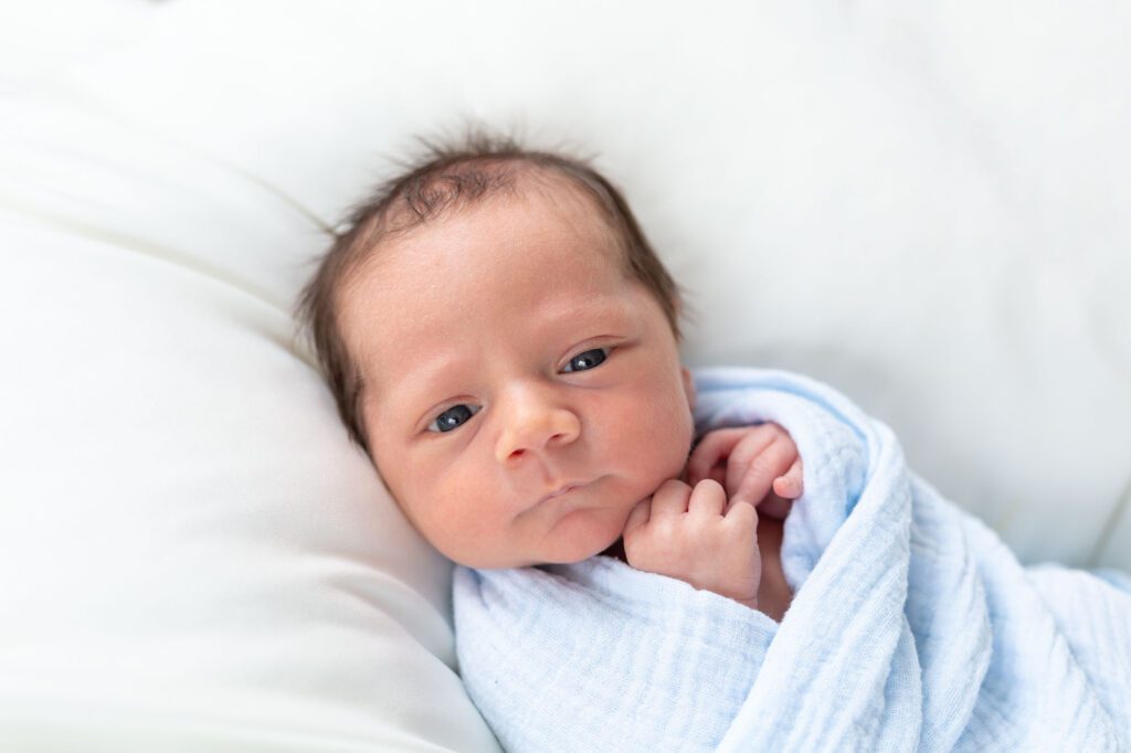 Newborns don't have to be asleep for their photo session.